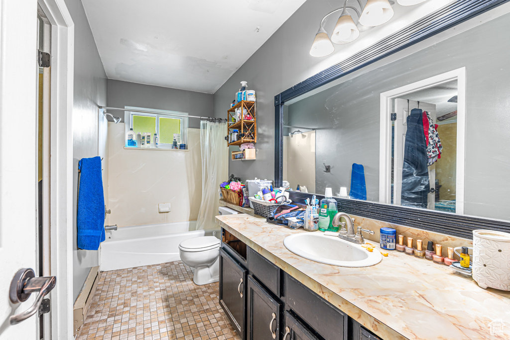 Full bathroom with vanity and shower / bathtub combination with curtain