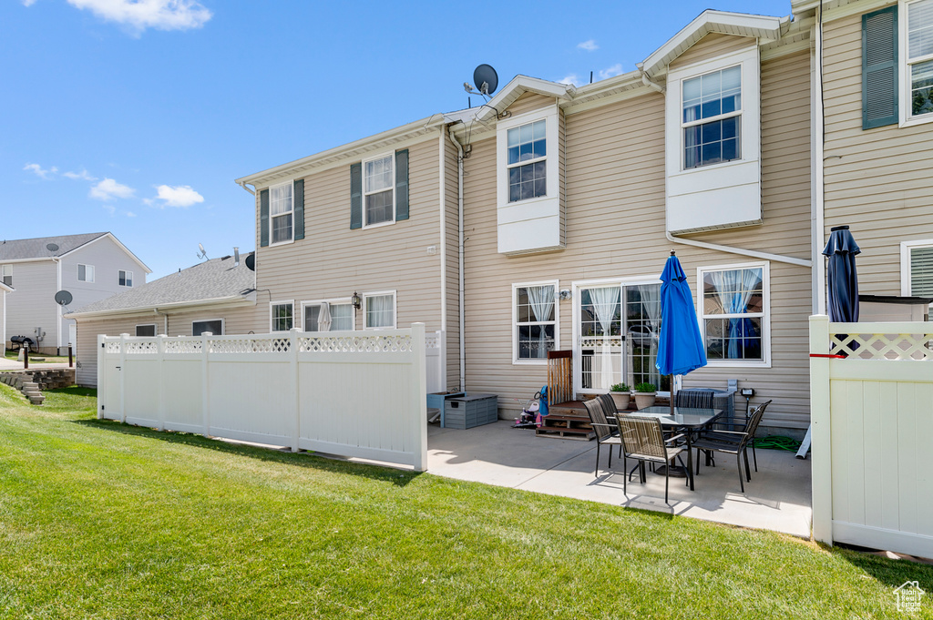 Rear view of house featuring a patio