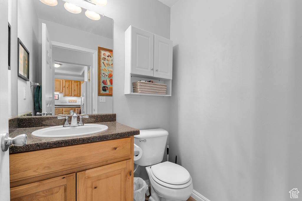 Bathroom featuring toilet and vanity