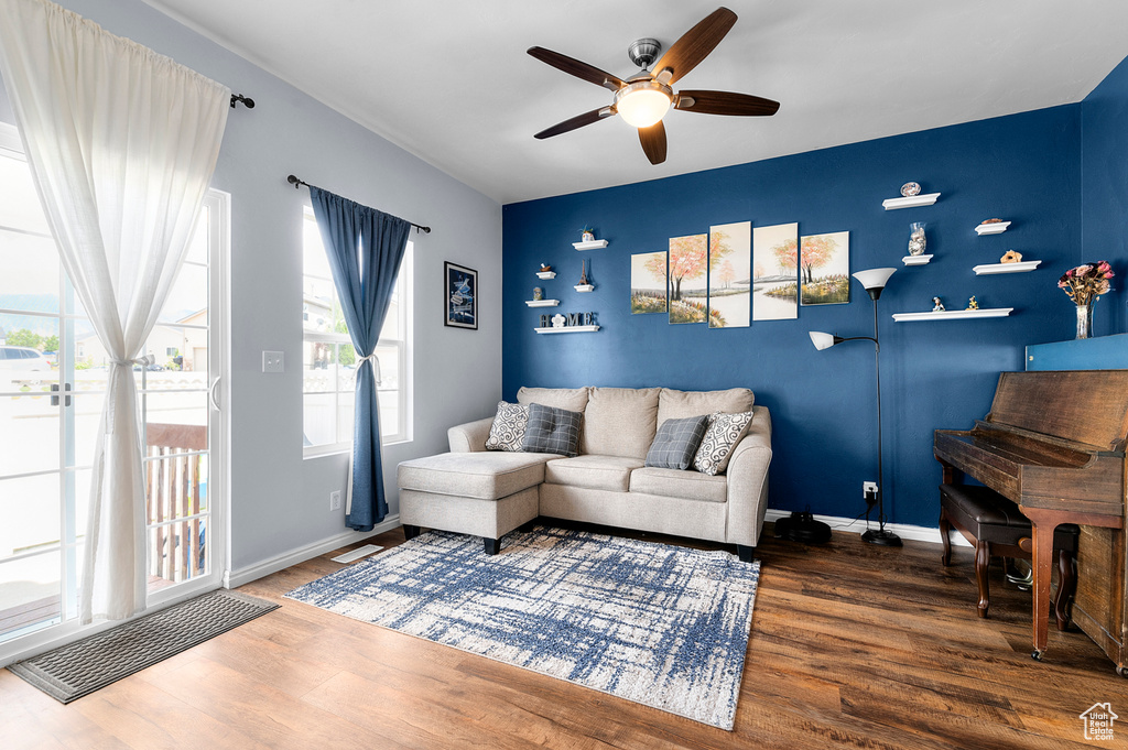 Living area featuring a ceiling fan and wood finished floors
