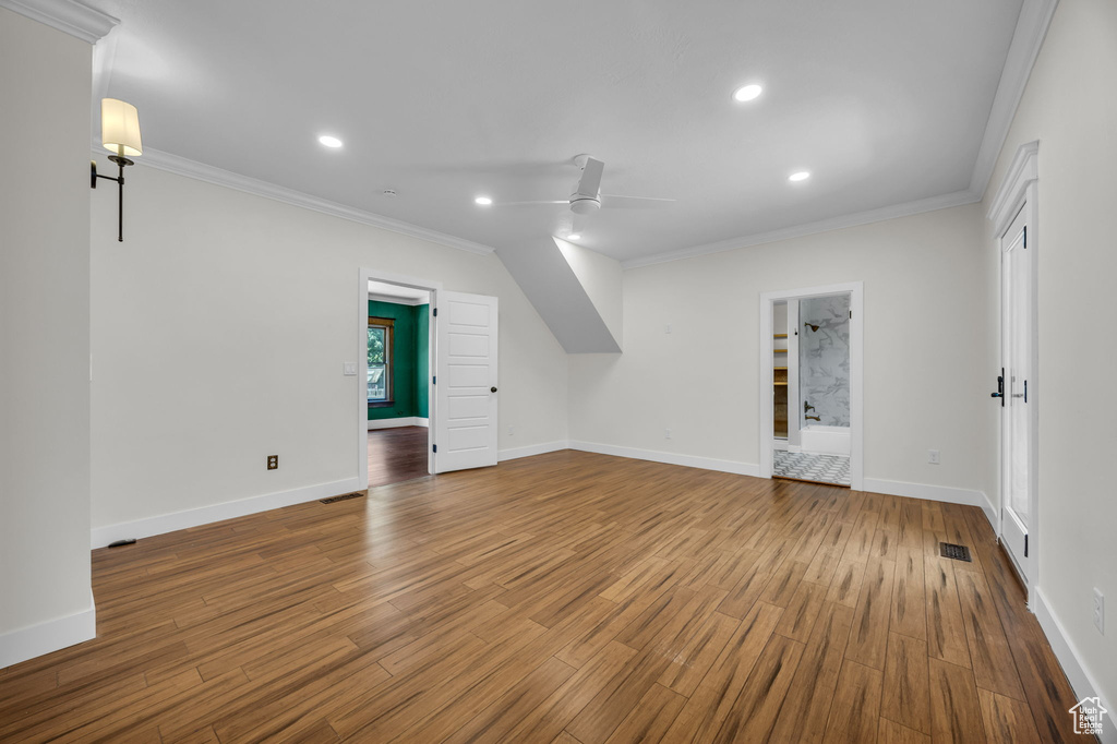 Bonus room with a ceiling fan, wood finished floors, and recessed lighting