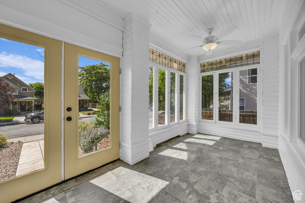 Unfurnished sunroom featuring wooden ceiling