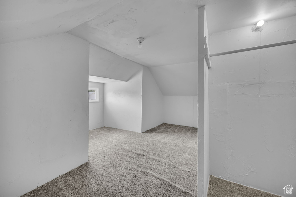 Bonus room with carpet and lofted ceiling