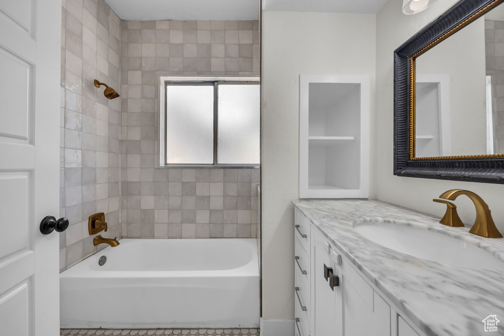 Full bath with vanity, shower / bathtub combination, and tile patterned floors