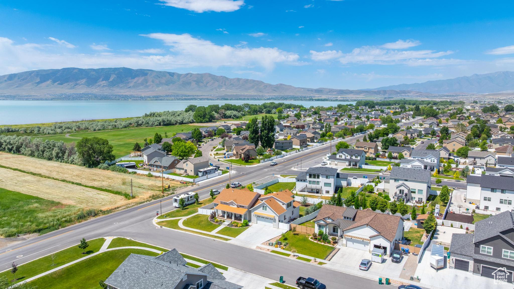 Aerial perspective of suburban area featuring a water and mountain view