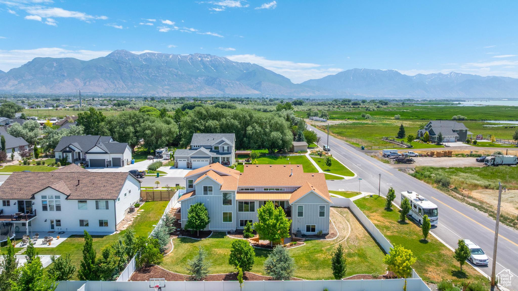 Aerial view of residential area featuring a mountainous background
