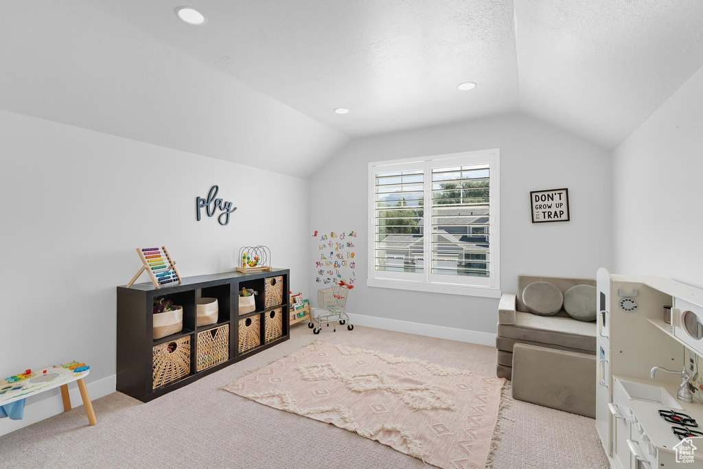 Game room featuring lofted ceiling, carpet, and recessed lighting