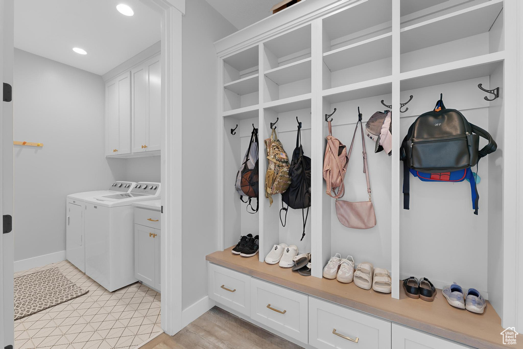 Mudroom featuring separate washer and dryer and recessed lighting