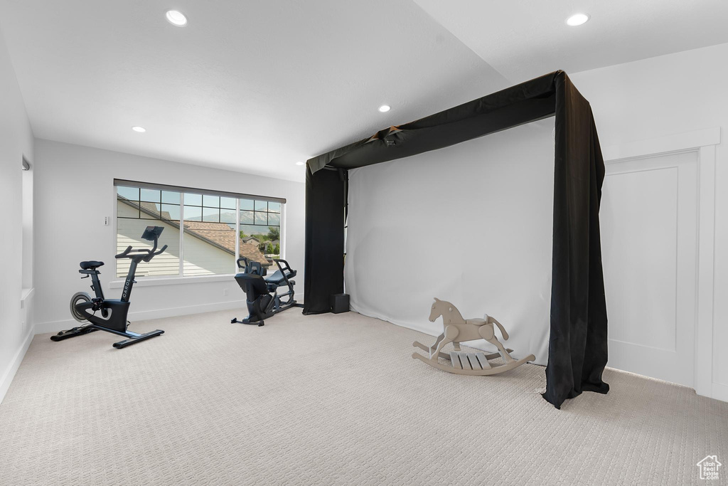 Exercise room with carpet flooring and recessed lighting