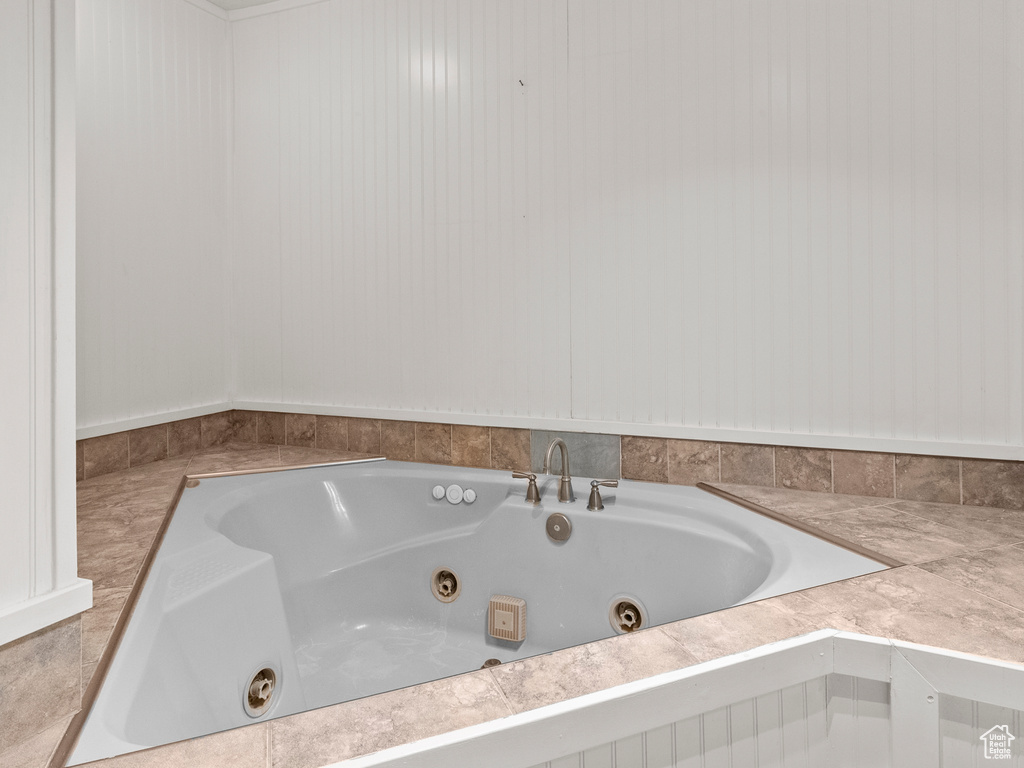 Bathroom featuring a tub with jets