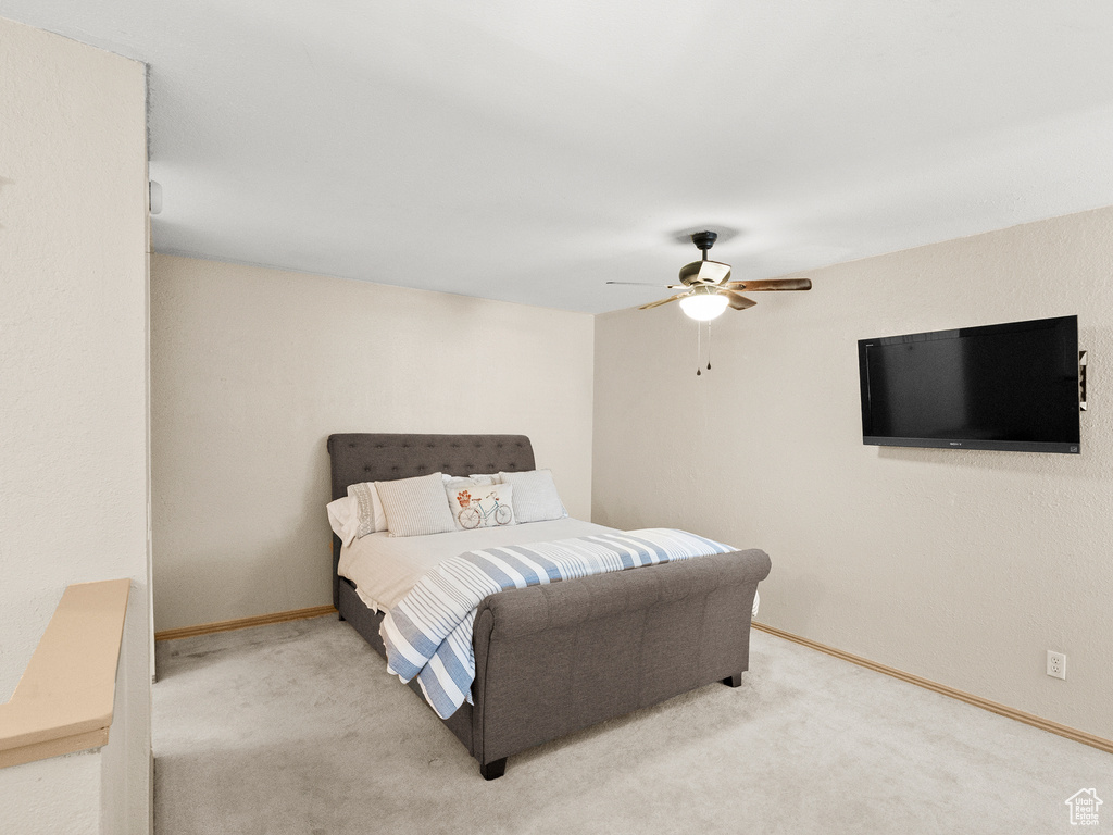 Bedroom featuring carpet and ceiling fan