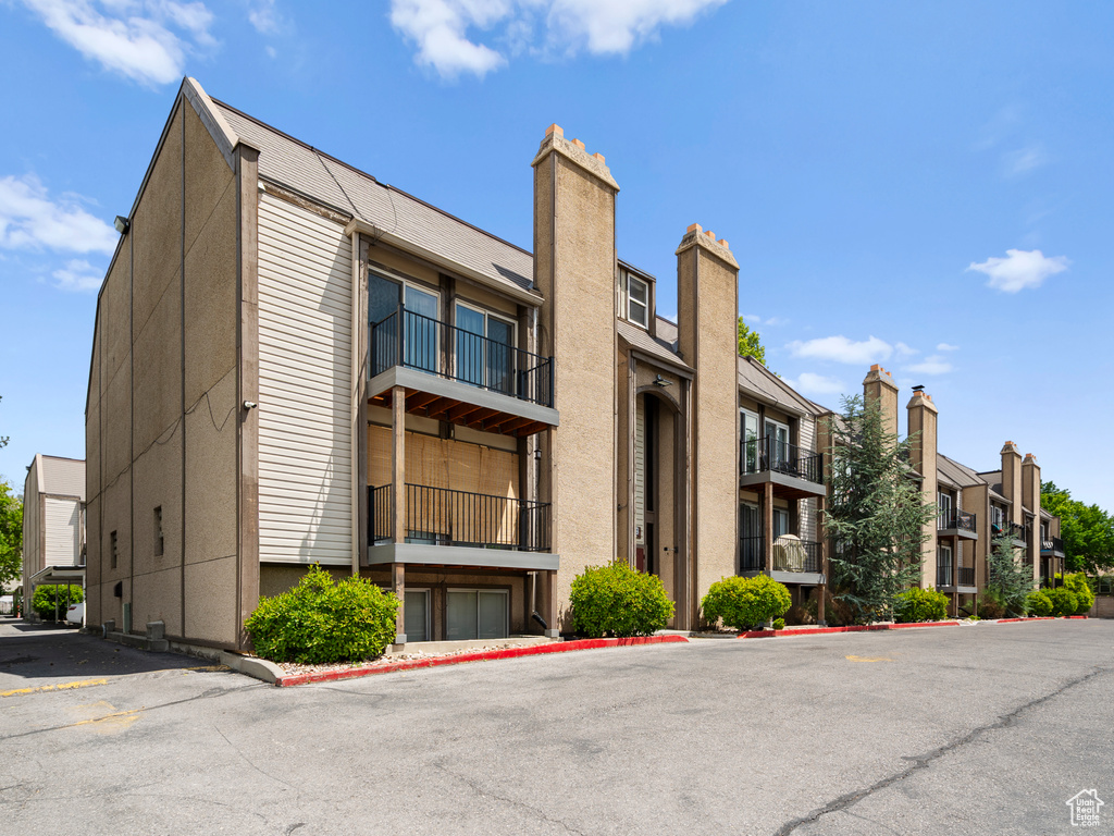 View of property with a residential view