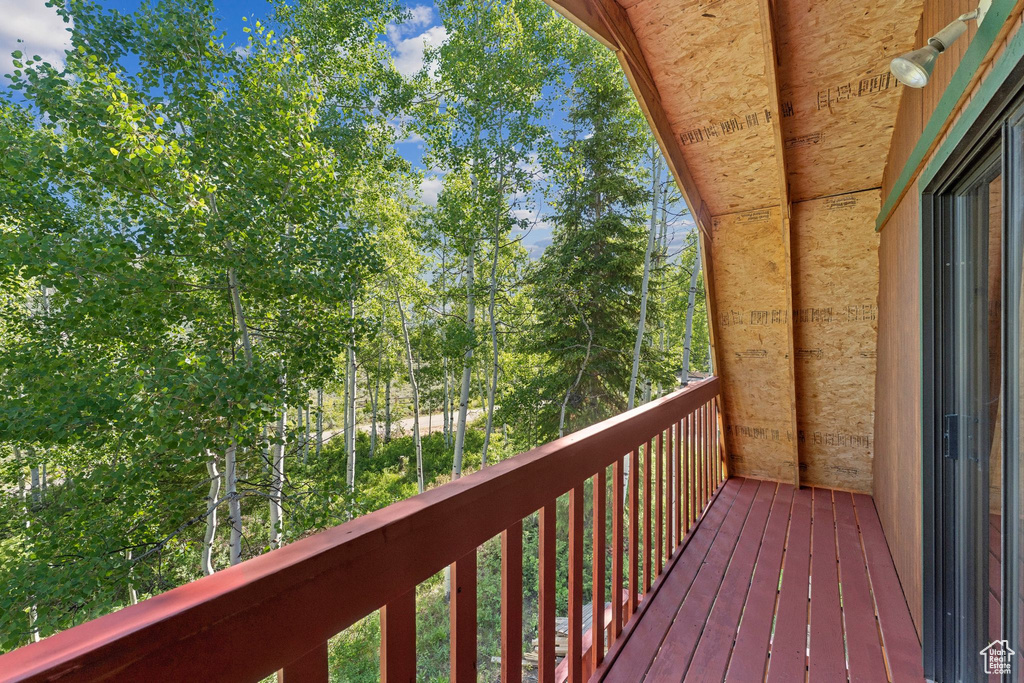 Deck with view of wooded area