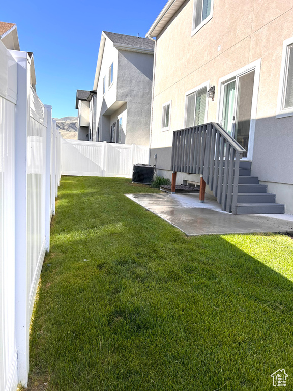Fenced backyard with a patio area