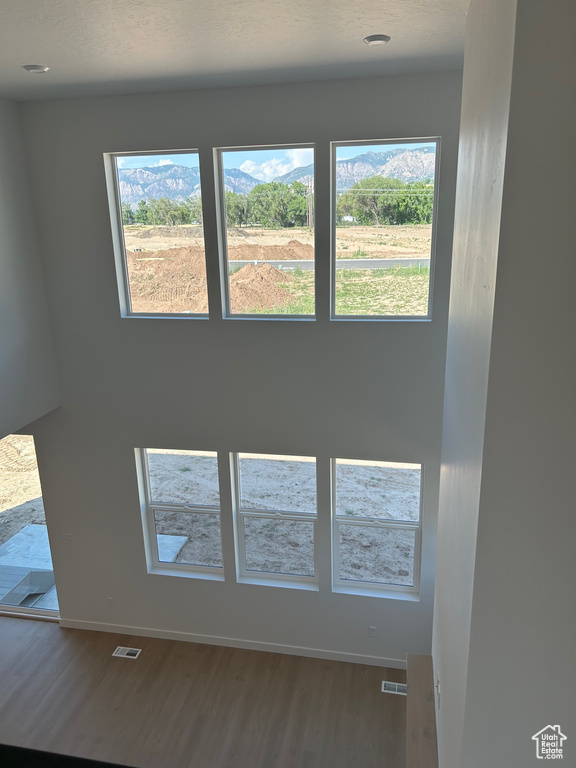 Detailed view of wood finished floors and baseboards