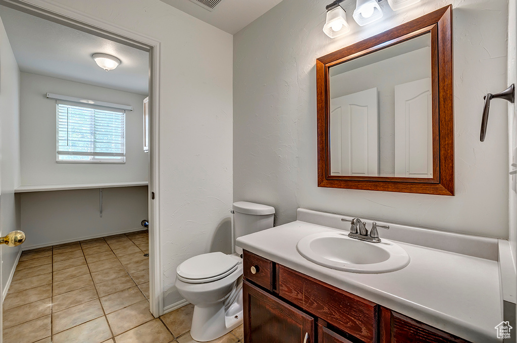 Bathroom with vanity and tile patterned floors