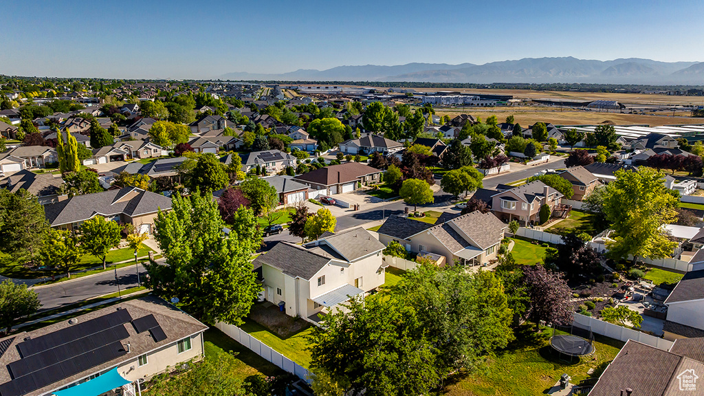 Aerial view of residential area featuring mountains