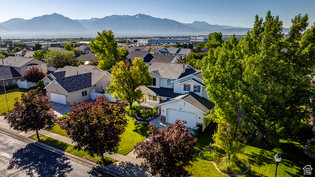 Aerial perspective of suburban area featuring a mountain backdrop