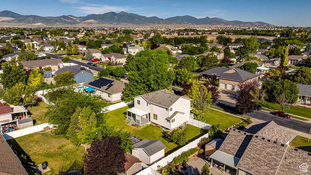 Aerial view of residential area featuring a mountainous background