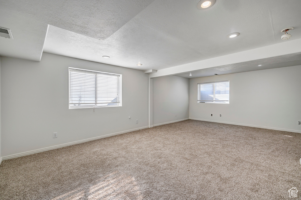 Unfurnished room featuring carpet floors, a textured ceiling, and recessed lighting