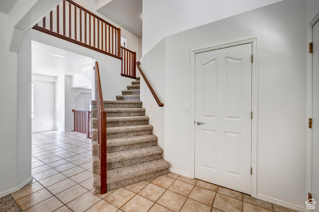 Stairway with tile patterned flooring