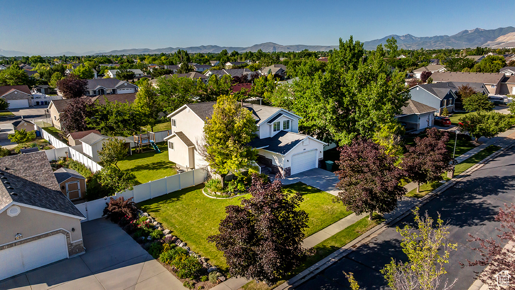 Aerial view of residential area featuring mountains