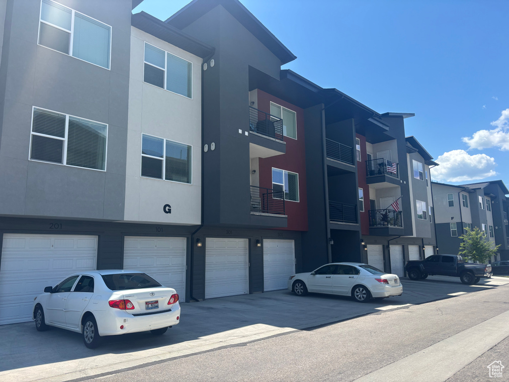 View of property with an attached garage
