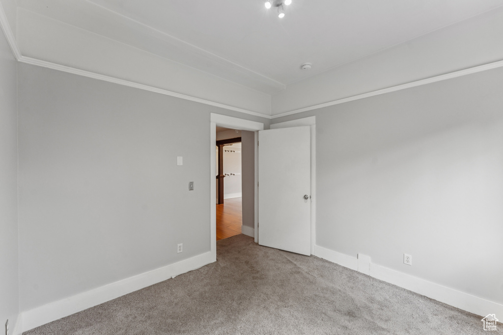 Spare room with carpet floors and a smoke detector
