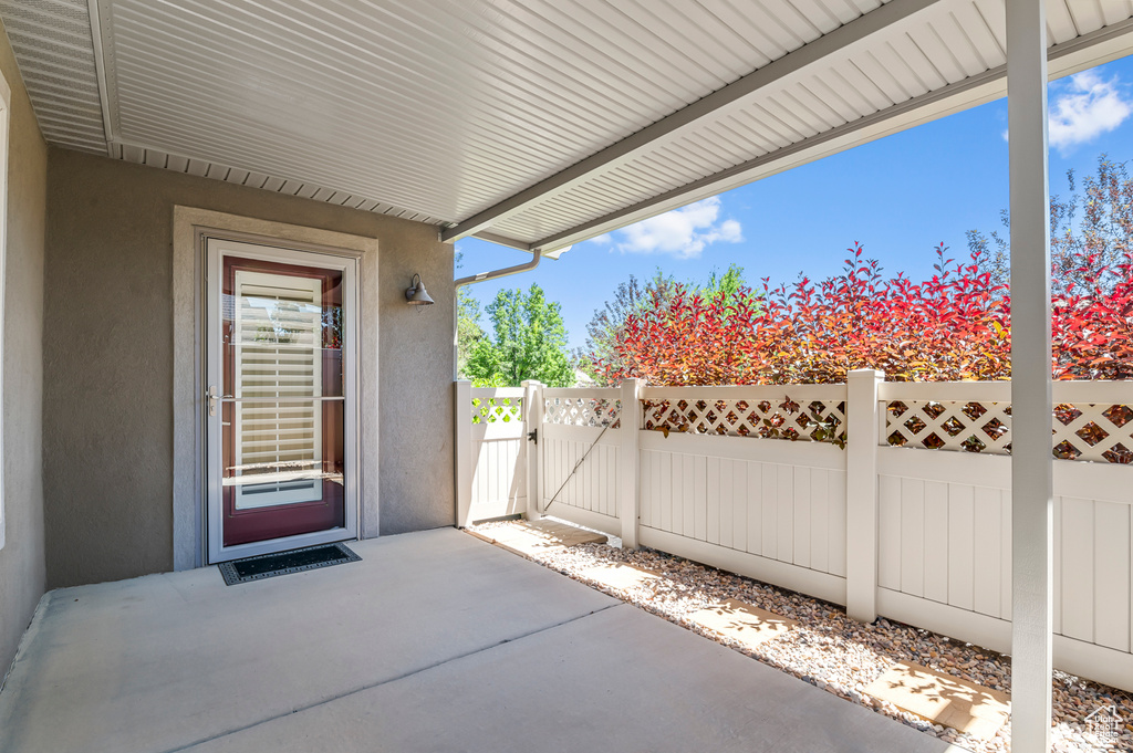 View of patio with a gate