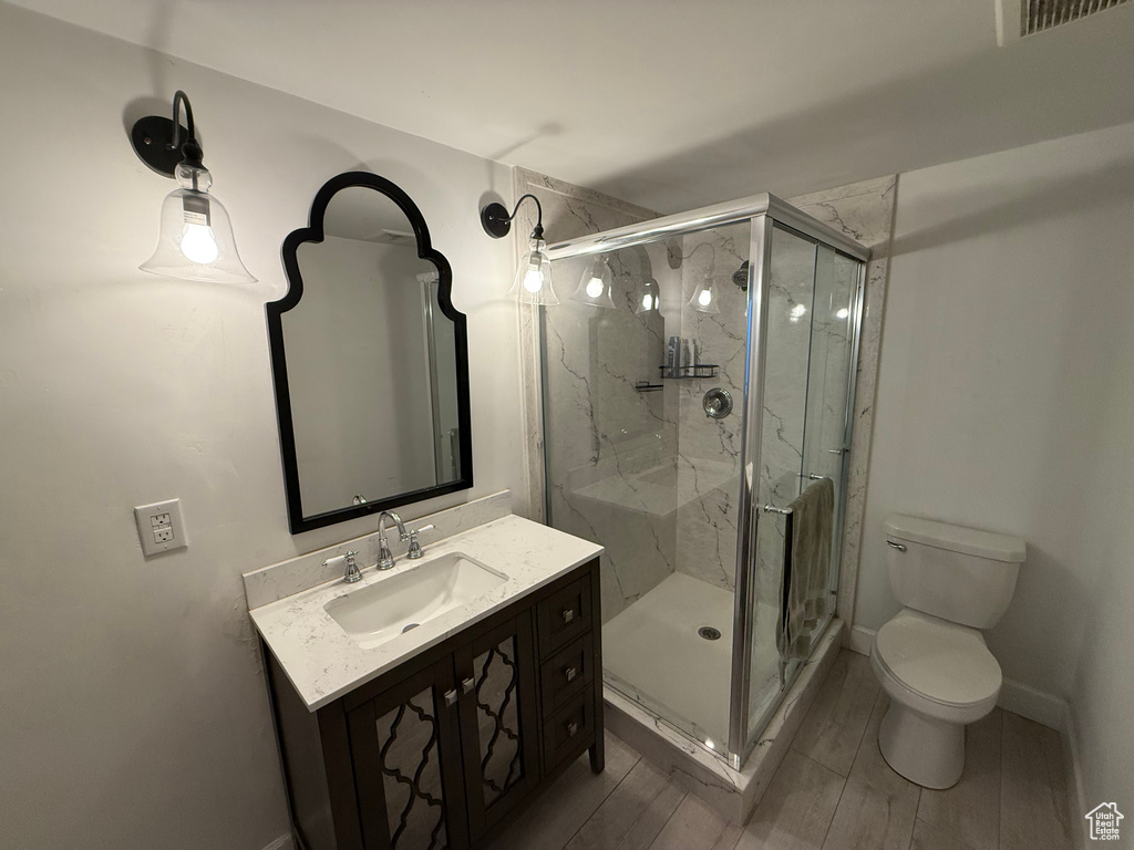Full bathroom with vanity and a marble finish shower
