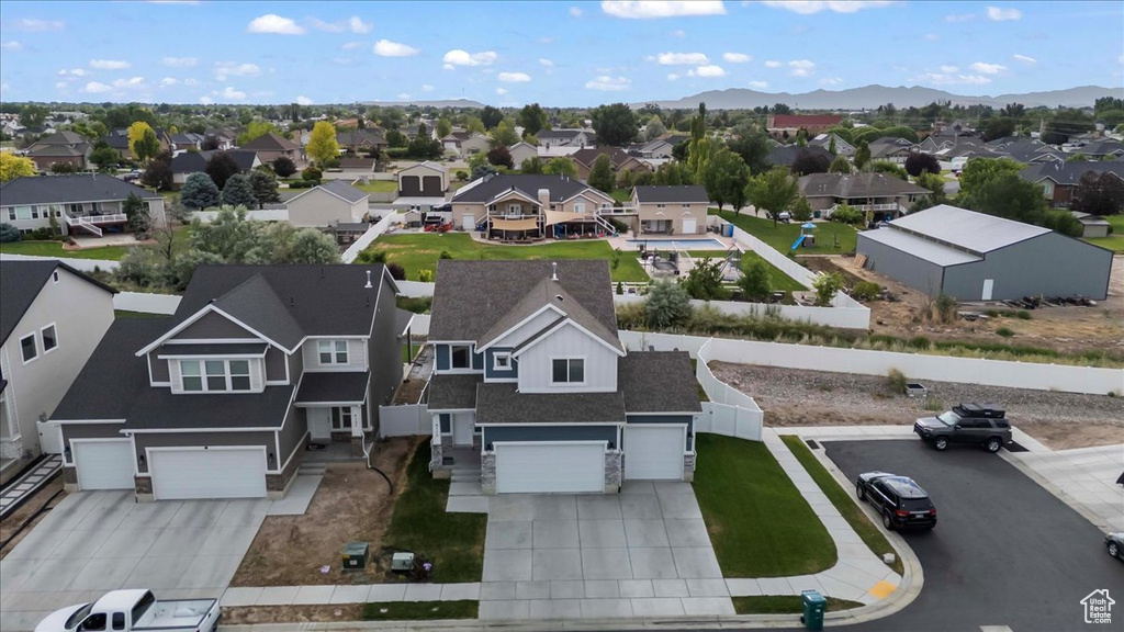 Aerial perspective of suburban area with a mountainous background