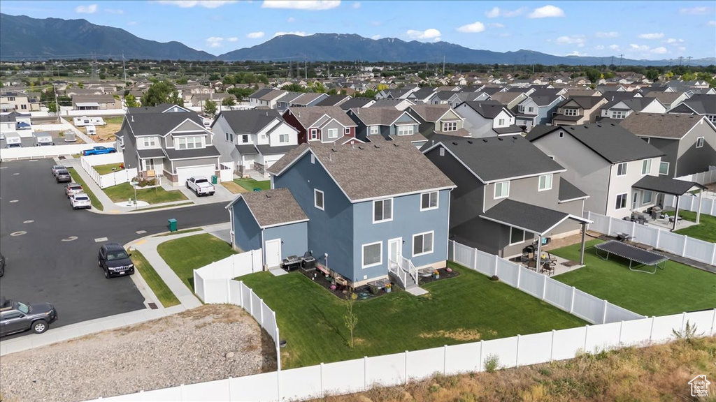 Aerial perspective of suburban area with a mountainous background
