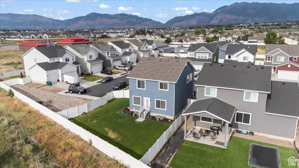 Aerial view of residential area with a mountainous background