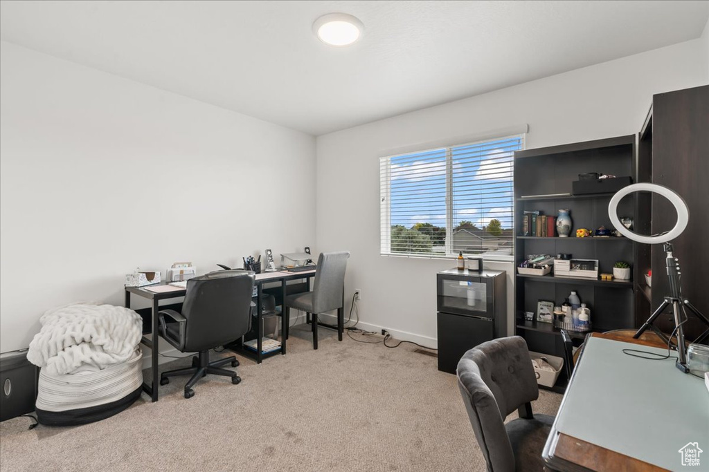Office space with carpet floors and baseboards
