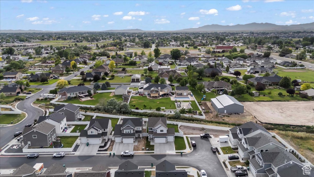 Aerial perspective of suburban area with a mountainous background