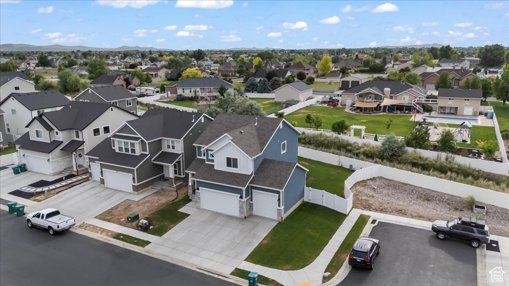 Aerial perspective of suburban area featuring a mountain backdrop
