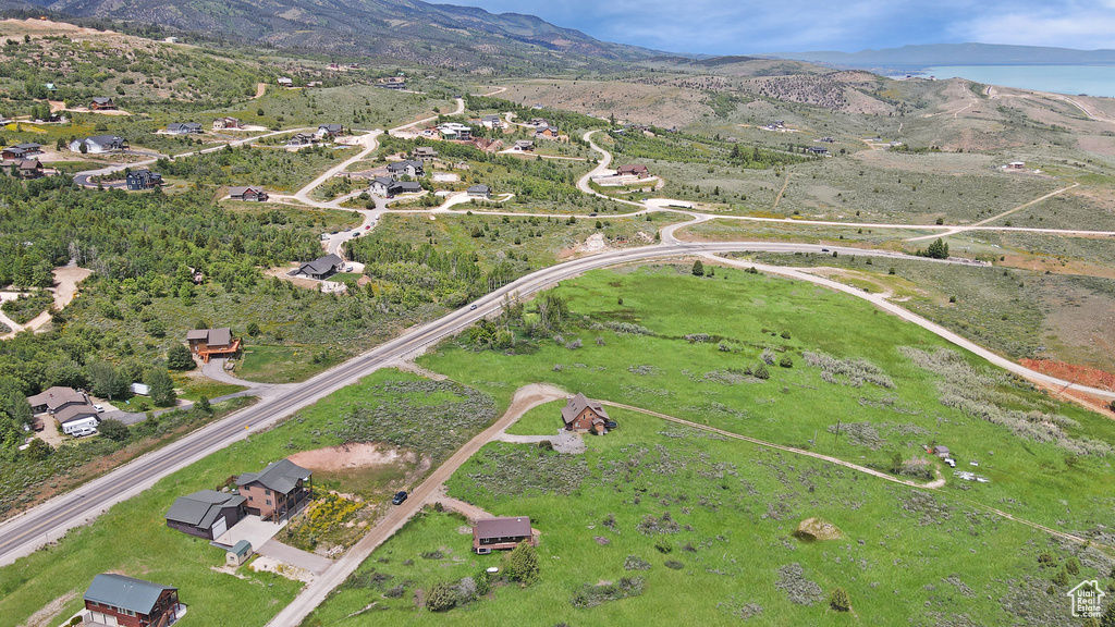 Aerial overview of property's location with a mountainous background