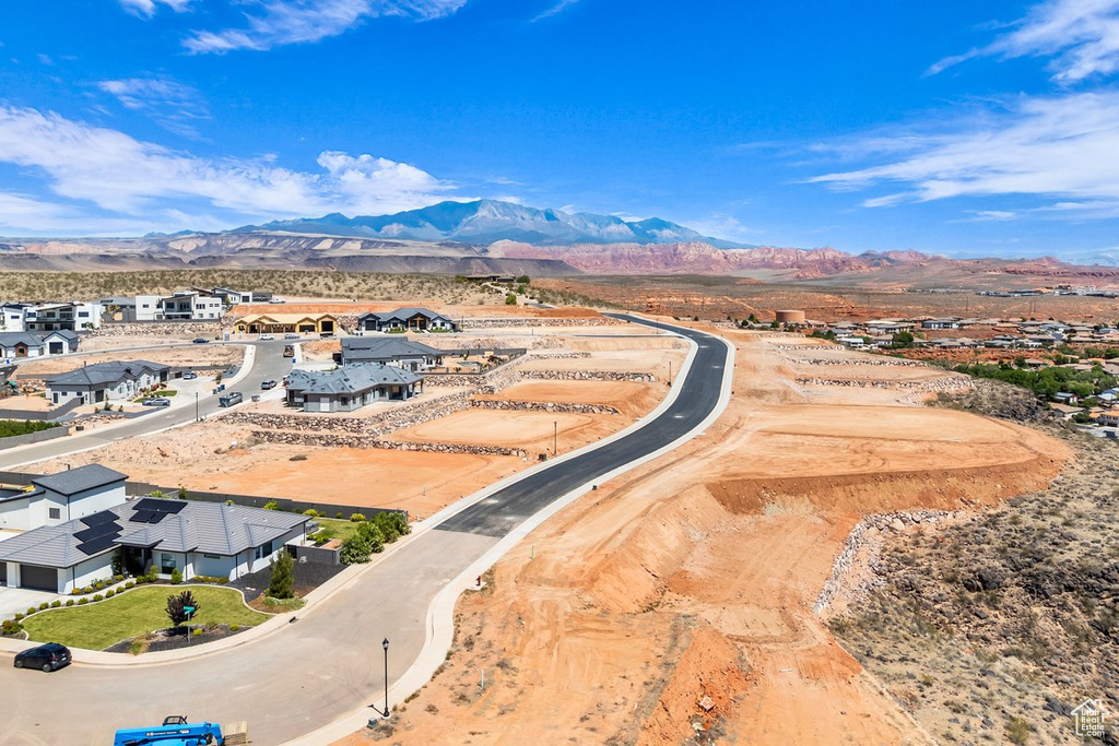 Aerial perspective of suburban area with a mountainous background