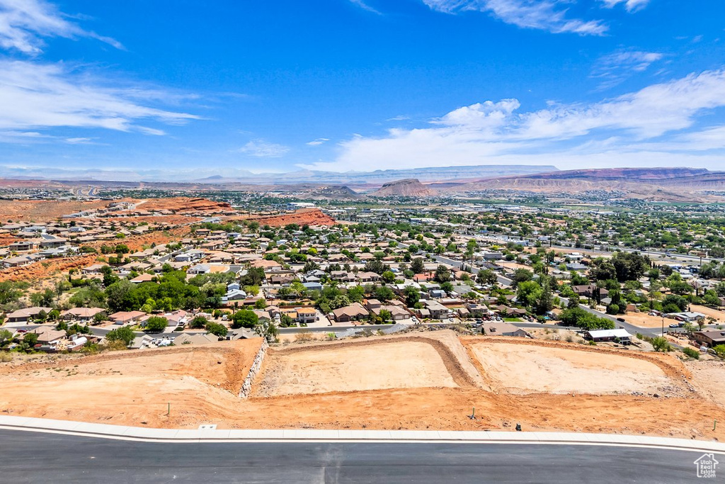 Aerial view of residential area featuring a mountain backdrop