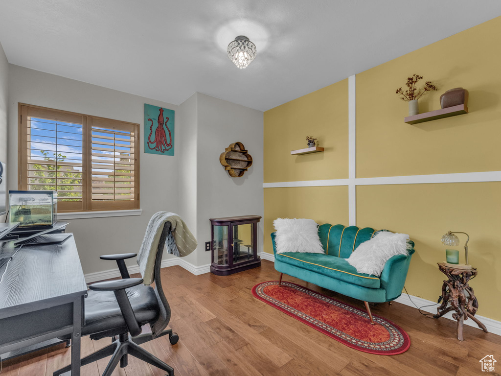 Office space with wood finished floors and baseboards