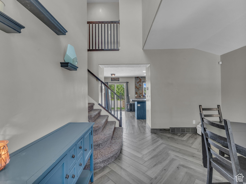 Entryway with stairs and baseboards