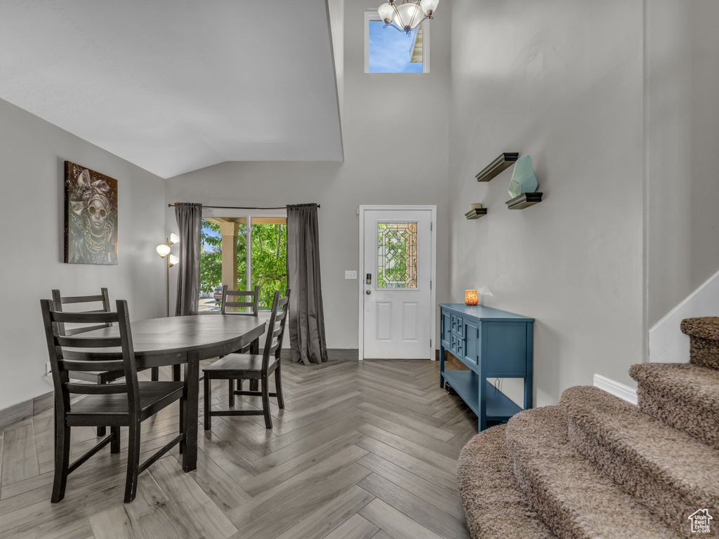 Dining room with stairway and lofted ceiling