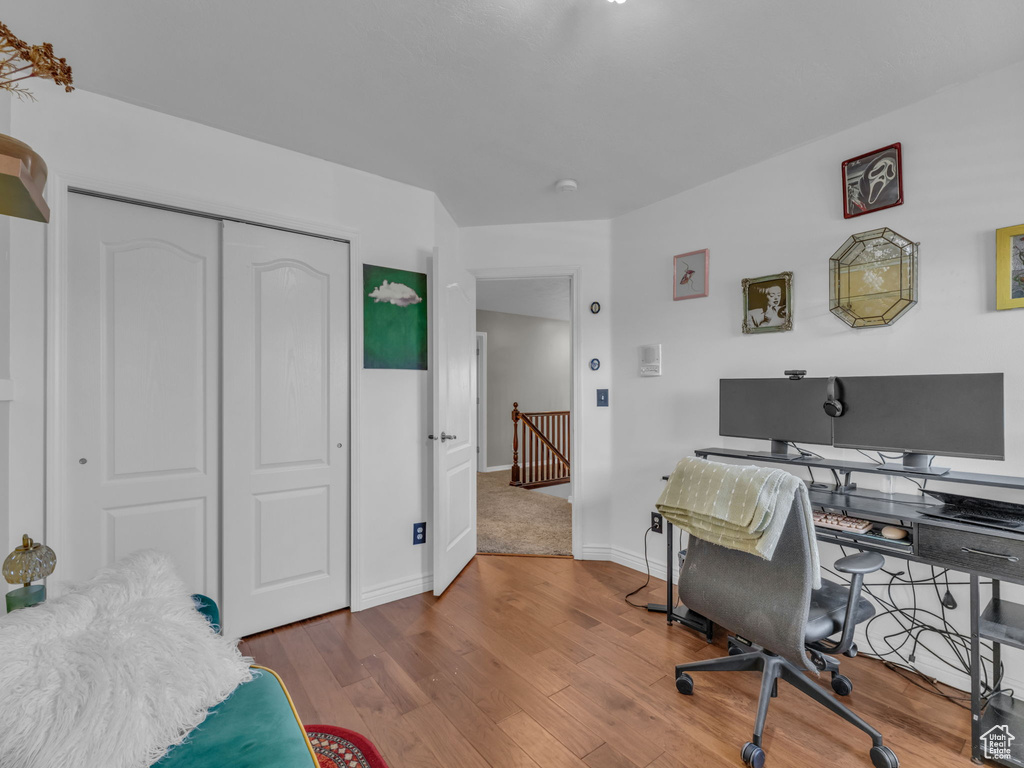 Home office featuring wood finished floors and baseboards