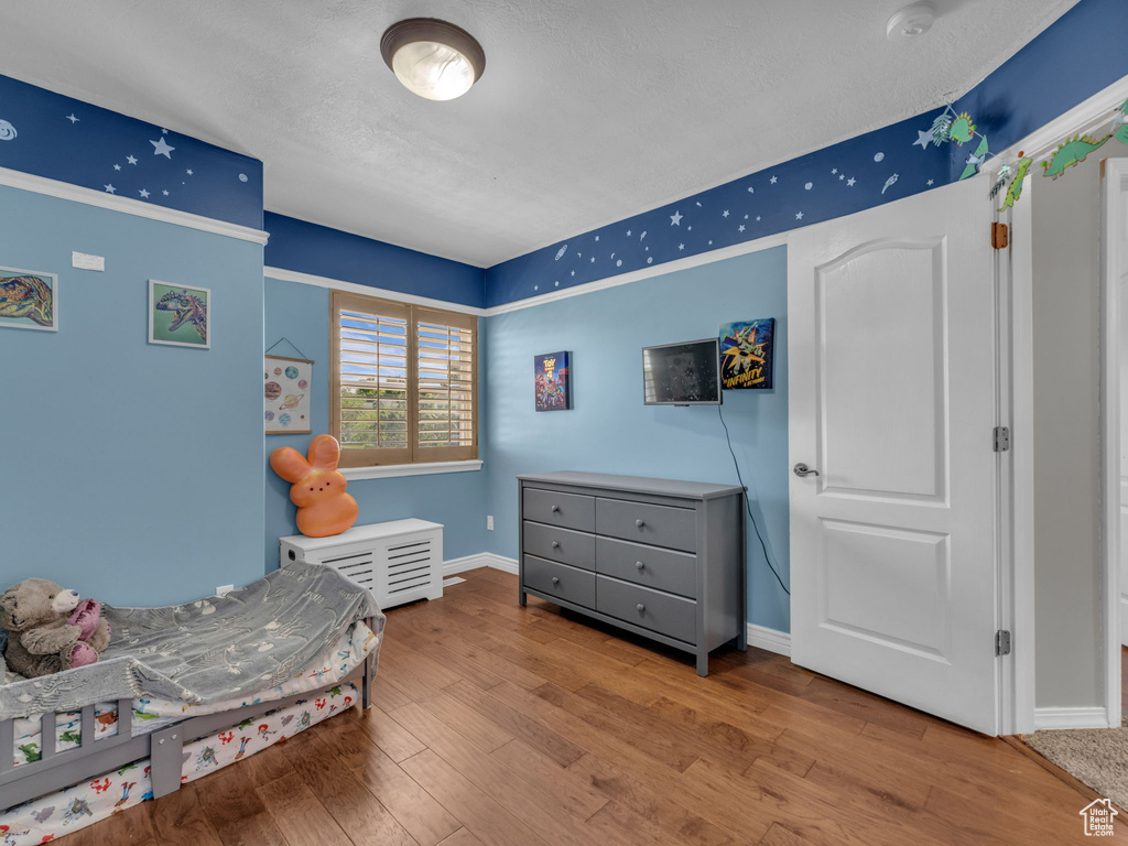 Bedroom with wood finished floors