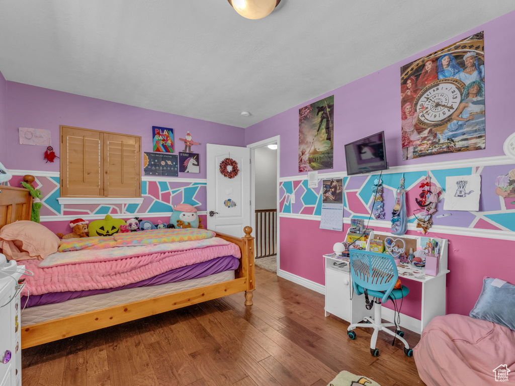 Bedroom with wood finished floors