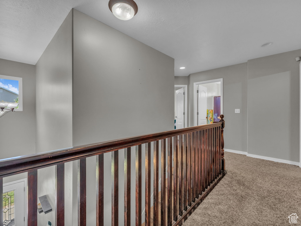 Hall with carpet and recessed lighting