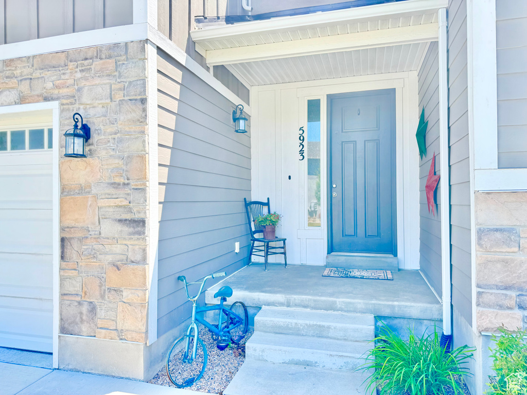Property entrance featuring stone siding
