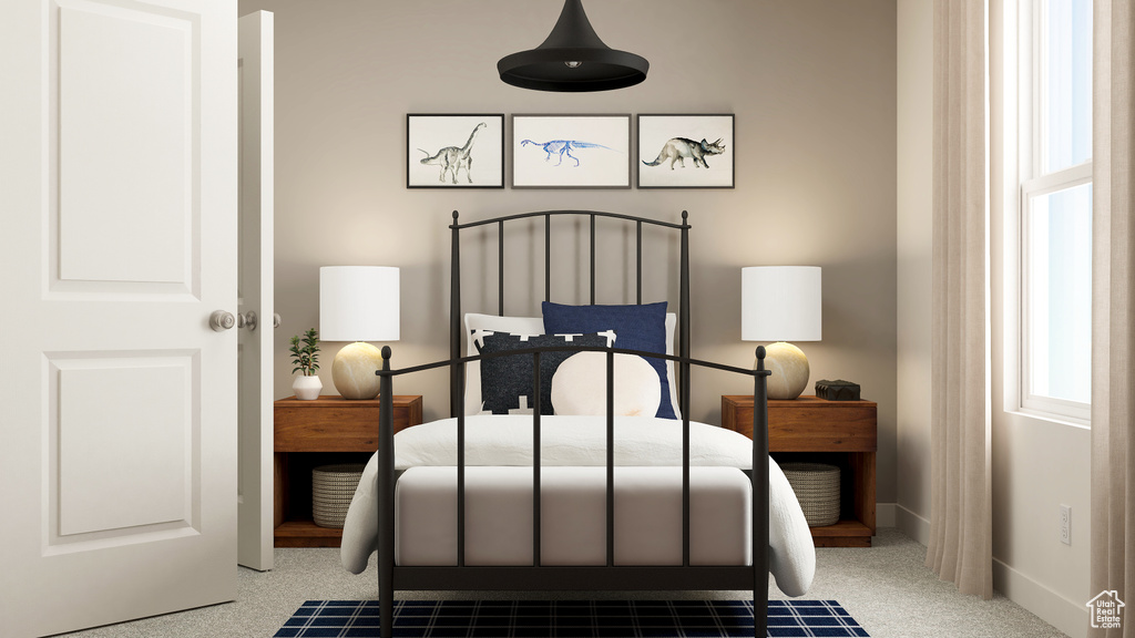 Carpeted bedroom featuring baseboards