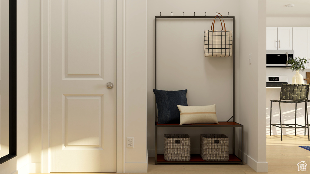 Mudroom with light wood-style flooring