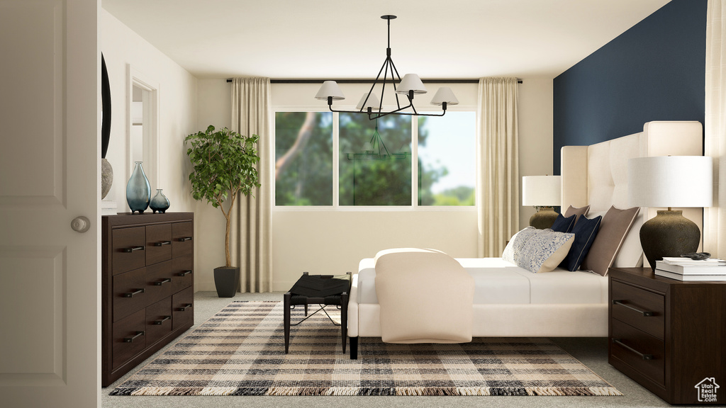 Bedroom with a chandelier and dark carpet